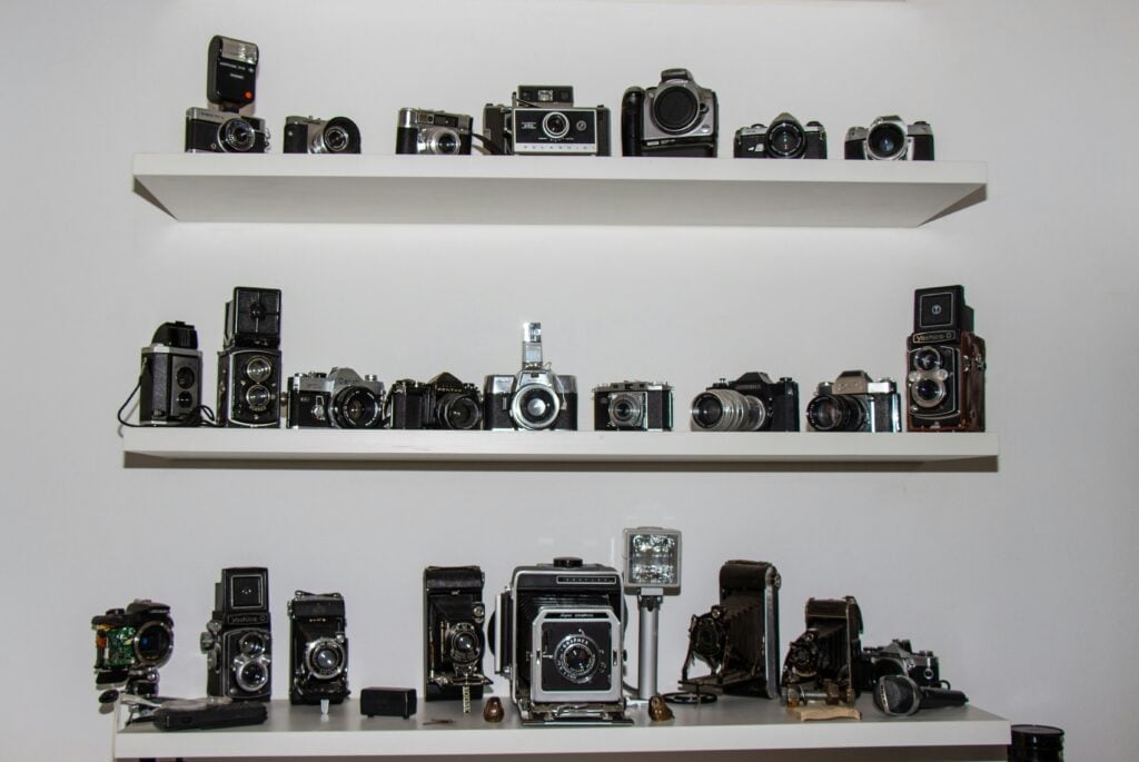 Collection of camera lenses and photographic accessories